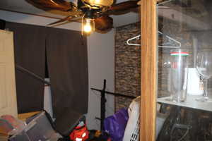 Duplex # A Basement featuring ceiling fan