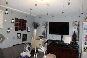 Duplex # A Living room featuring a textured ceiling