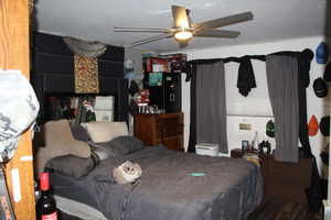 Duplex # A Bedroom featuring ceiling fan and hardwood / wood-style floors