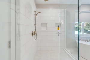 Primary shower with new tile and fixtures