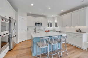 High end stainless appliances and custom cabinetry and lighting.