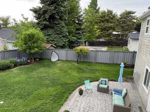 View of yard with an outdoor hangout area and a patio