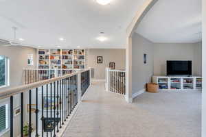 Upstairs loft with built in bookshelves