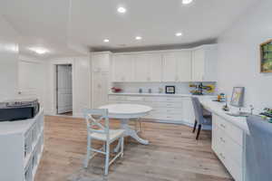 Large craft/homework room with built in desks and cabinetry