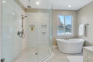 Deluxe primary suite with Euroglass shower and soaker tub