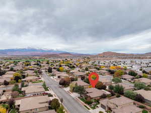 Aerial view of residential area featuring a mountain backdrop