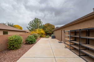 View of home's exterior with a fenced backyard, a patio, and stucco siding