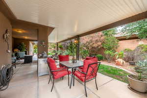 View of patio with outdoor dining area