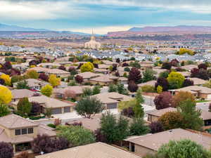 Aerial perspective of suburban area featuring a mountainous background