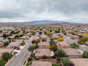 Aerial view of residential area featuring a mountain backdrop