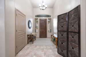 Foyer featuring a chandelier