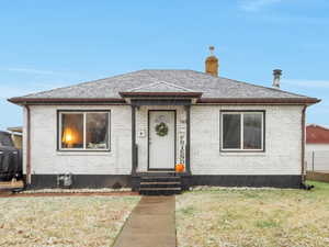 Bungalow with a front lawn