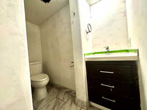 Bathroom featuring vanity and toilet