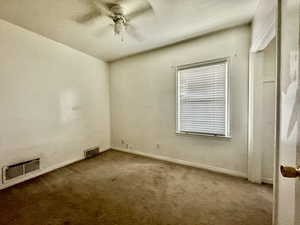 Unfurnished room with carpet flooring and ceiling fan