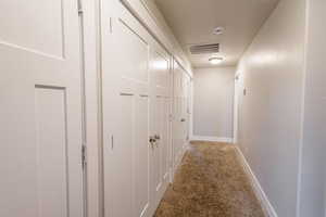 Hallway with carpet floors