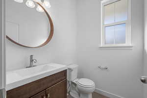 Bathroom featuring vanity and toilet