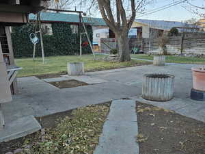 View of yard featuring a patio and a playground