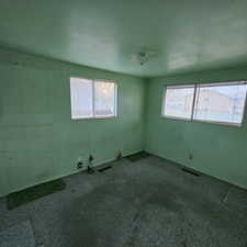 View of carpeted spare room