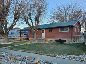 View of front of home featuring a front lawn