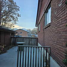 View of property exterior featuring a mountain view and a patio