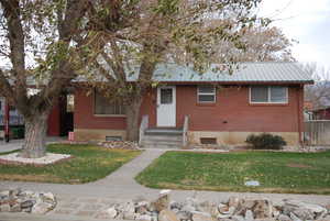 View of front of home featuring a front lawn