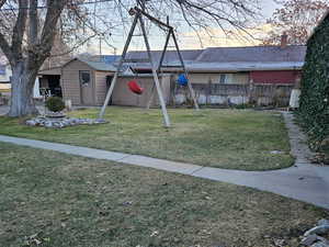 Yard at dusk with a playground