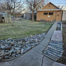 View of yard with an outbuilding