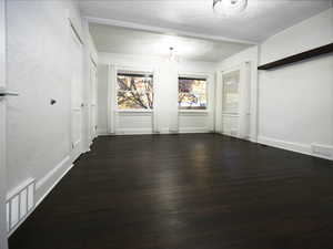 Unfurnished room with dark hardwood / wood-style floors