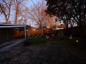 Yard at dusk with a patio