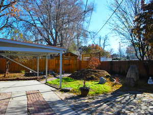 View of patio with a carport