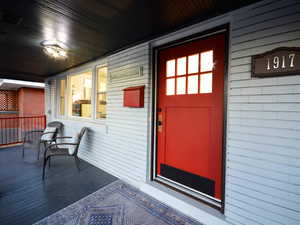 Property entrance with covered porch