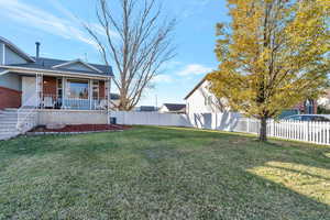 View of yard featuring a porch