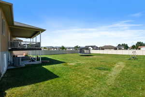 View of yard with a trampoline