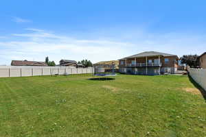 View of yard featuring a trampoline