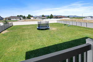 View of yard with a mountain view and a trampoline