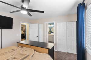 Bedroom featuring carpet flooring, ceiling fan, a textured ceiling, and connected bathroom