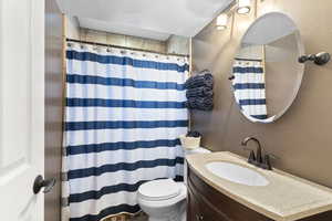 Bathroom with vanity and toilet