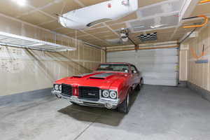 Garage featuring a carport and a garage door opener