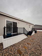 View of side of property with central AC