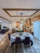 Dining room featuring hardwood / wood-style flooring and crown molding