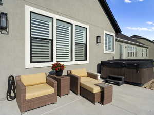 View of patio. Walking distance from pickle ball courts, basketball court, and a sledding hill.