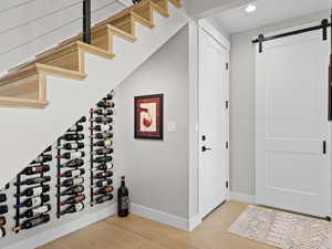 Wine storage with additional under house storage and hardwood flooring