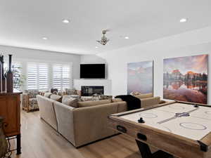 Living  with ceiling fan and light hardwood floors