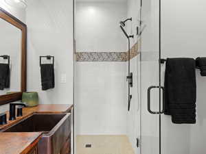 Secondary Bathroom with copper vanity and walk in shower