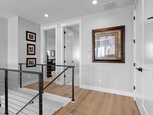 Corridor with light hardwood floors