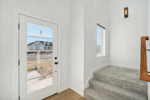 Doorway to outside featuring light hardwood / wood-style floors