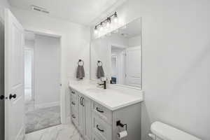 Bathroom with vanity and toilet