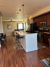 View of entire kitchen minus table dining area viewed in next photo.