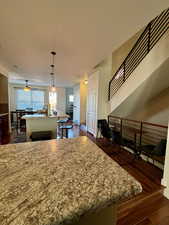 View is from peninsula family room side looking into the kitchen. more seating in kitchen is available next to the stairs. Great for entertaining!