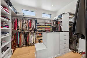 Walk in closet featuring light hardwood / wood-style floors